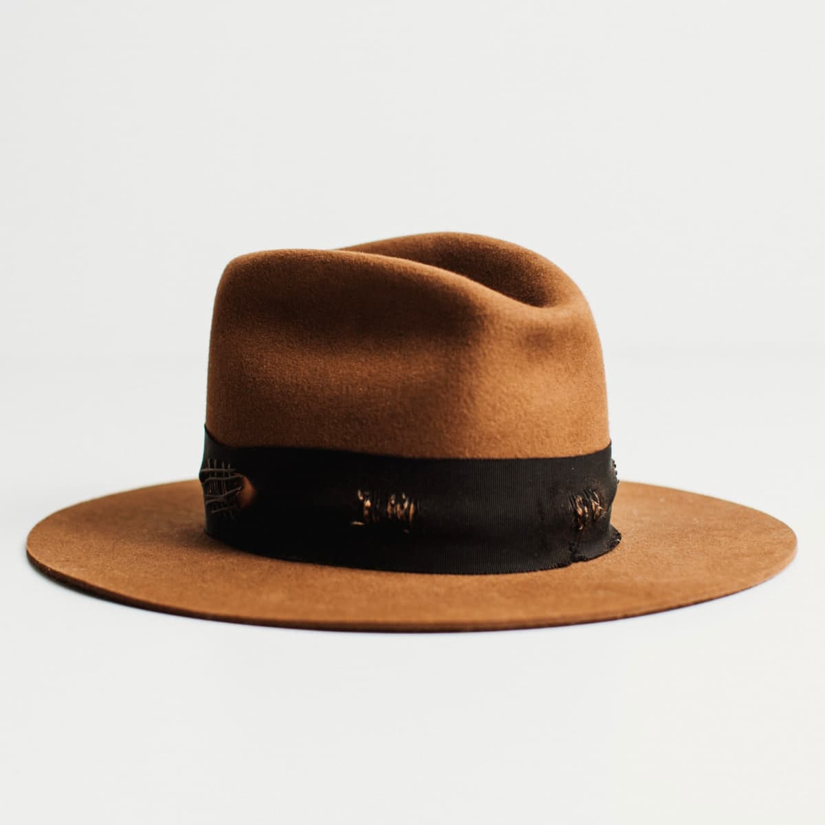 Front right angled view of The Open Road caramel felt hat with Open Road cowboy crown and black grosgrain band by PHYLLi Designs.