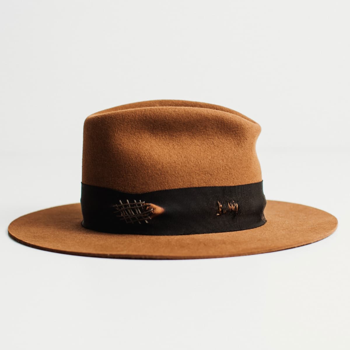Right side view of caramel felt hat with Open Road cowboy crown and black grosgrain band.