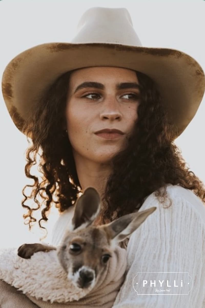 Sarah Wheeler wearing The Wheeler premium felt hat in distressed Beige with 12 strand leather hat band in Chocolate.