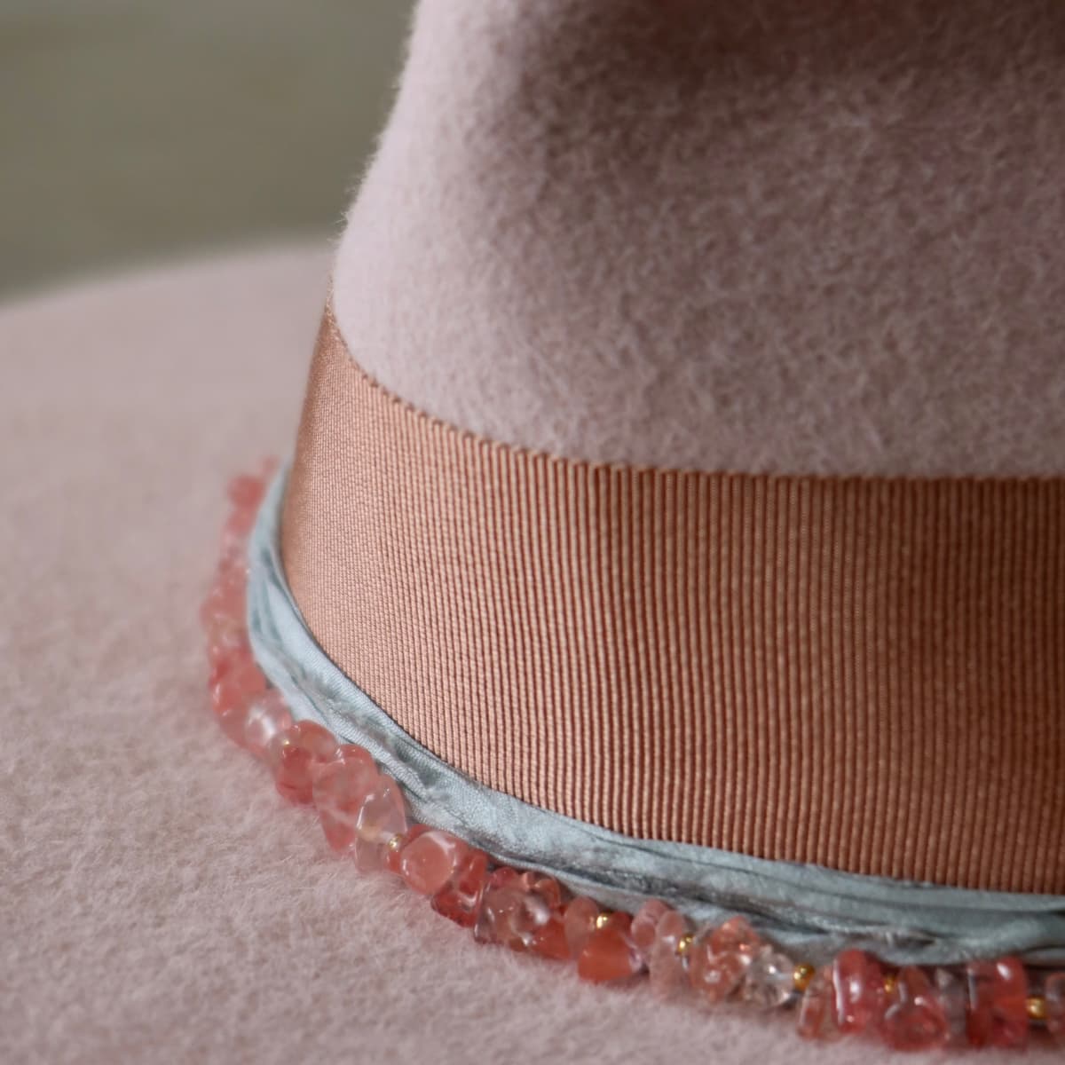 Close up detail of the Tourmaline felt hat showing ocean sari silk trim beneath the grosgrain band.