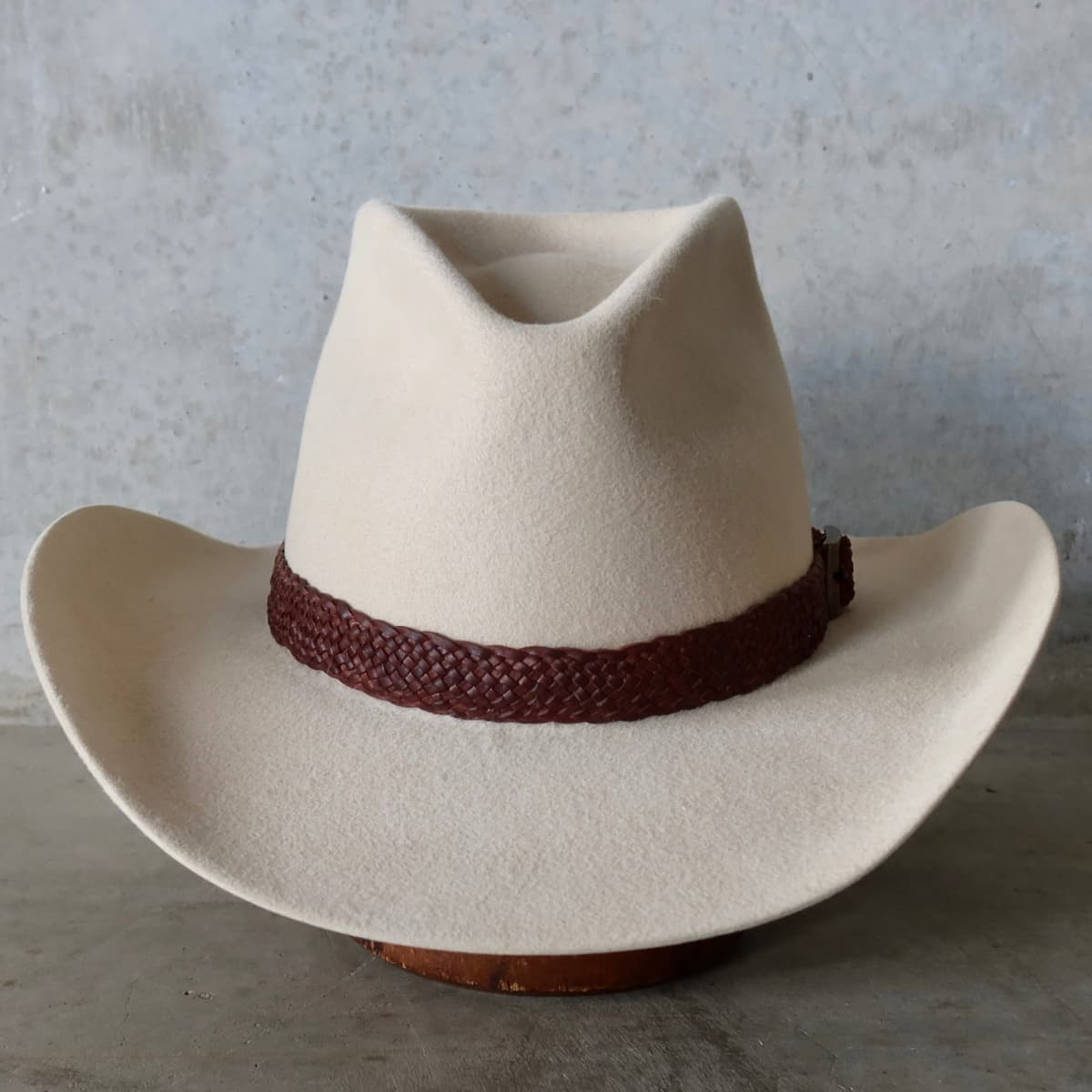 Beige cowboy hat Wheeler Beige by PHYLLi Designs with 12 strand chocolate leather hat band.
