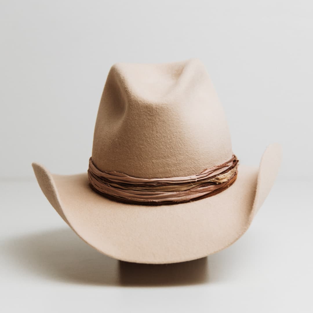 Wrapped Wheeler beige felt hat by PHYLLi Designs with dusty pink and nude tie dye sari silk wrapped band.