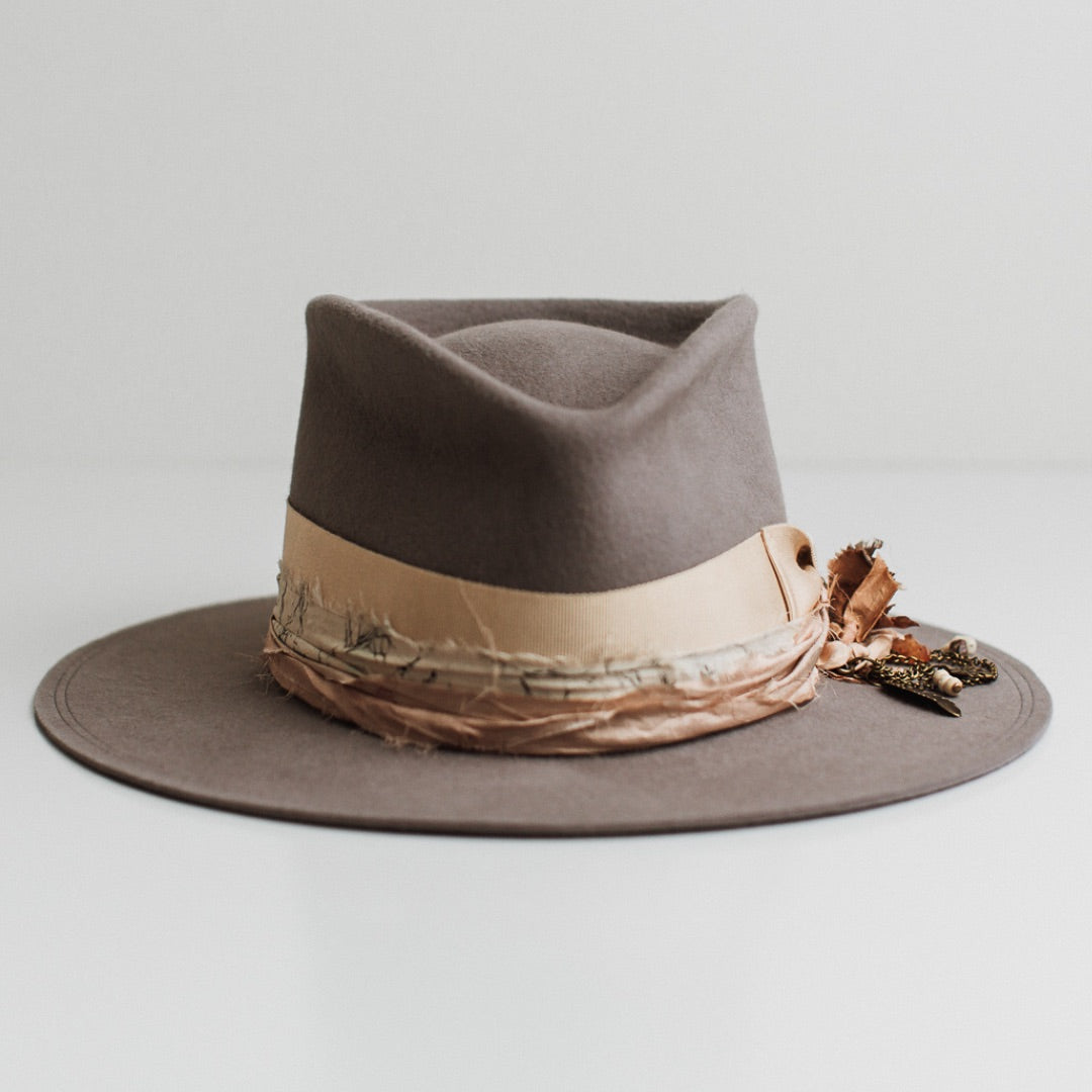 Arrowtown taupe felt hat by PHYLLi Designs with sand Japanese grosgrain bow band and apricot sari silk trimming.
