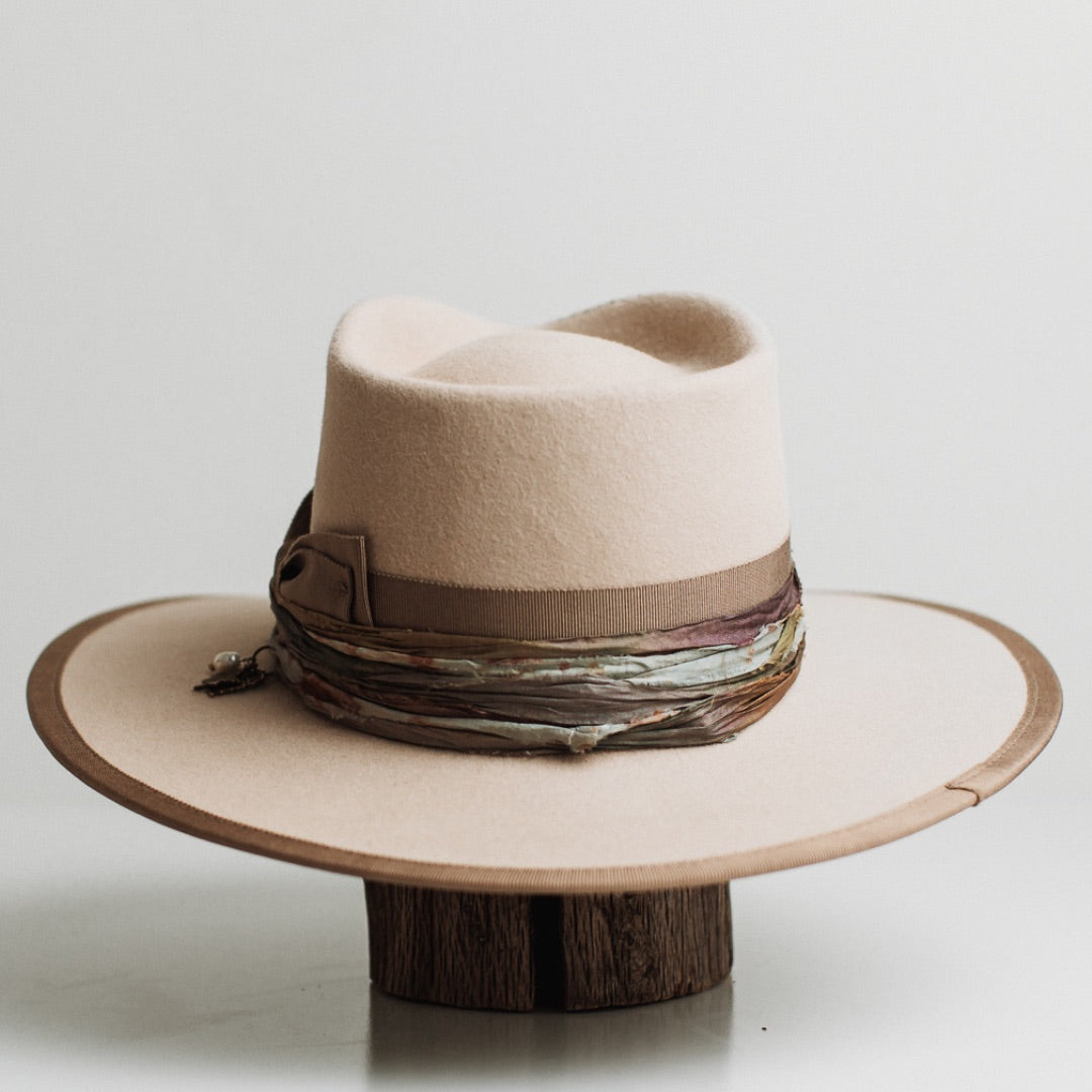 Back view of the Cunningham beige felt hat by PHYLLi Designs featuring taupe grosgrain bow band and taupe grosgrain brim trim.