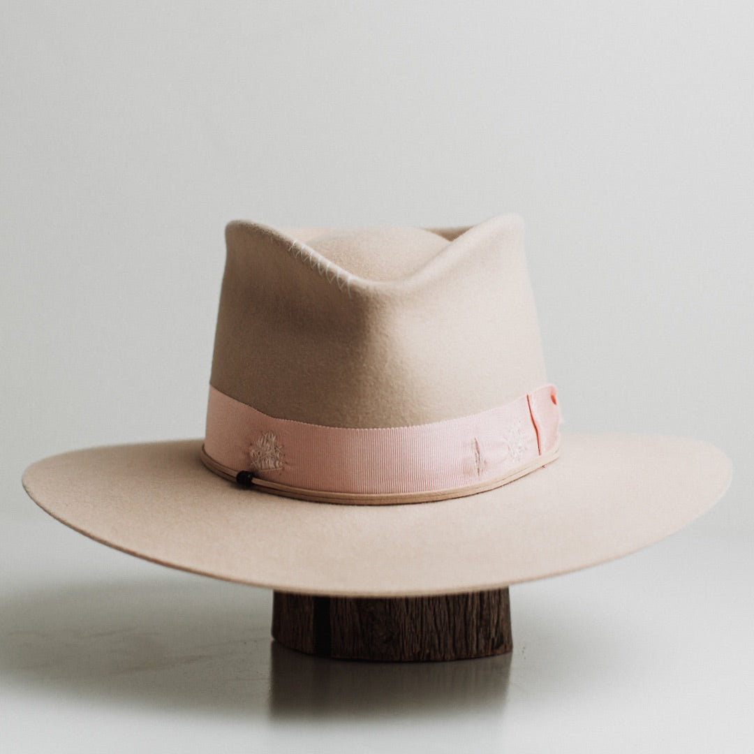 Curlewis beige felt hat by PHYLLi Designs with distressed sherbet pink Japanese grosgrain bow band.