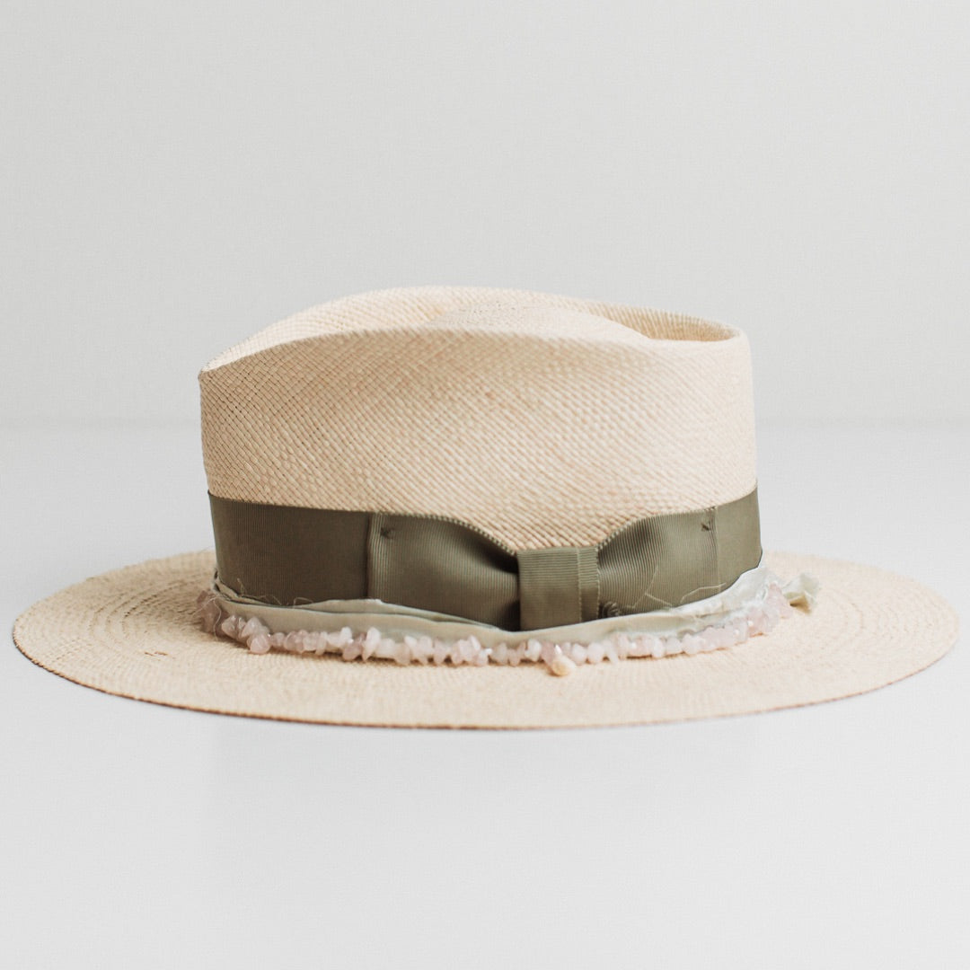 Left side view of the Isle of Skye natural Panama hat by PHYLLi Designs with rose quartz hat necklace and mint sari silk wrap.