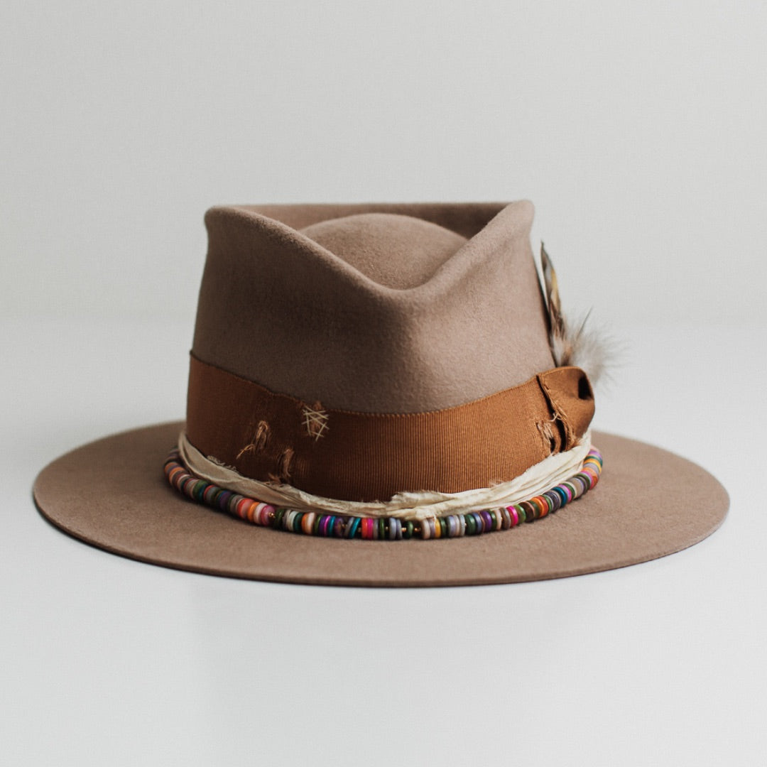 Mango Sahara felt hat by PHYLLi Designs with distressed copper Japanese grosgrain bow band and rainbow disc hat necklace.