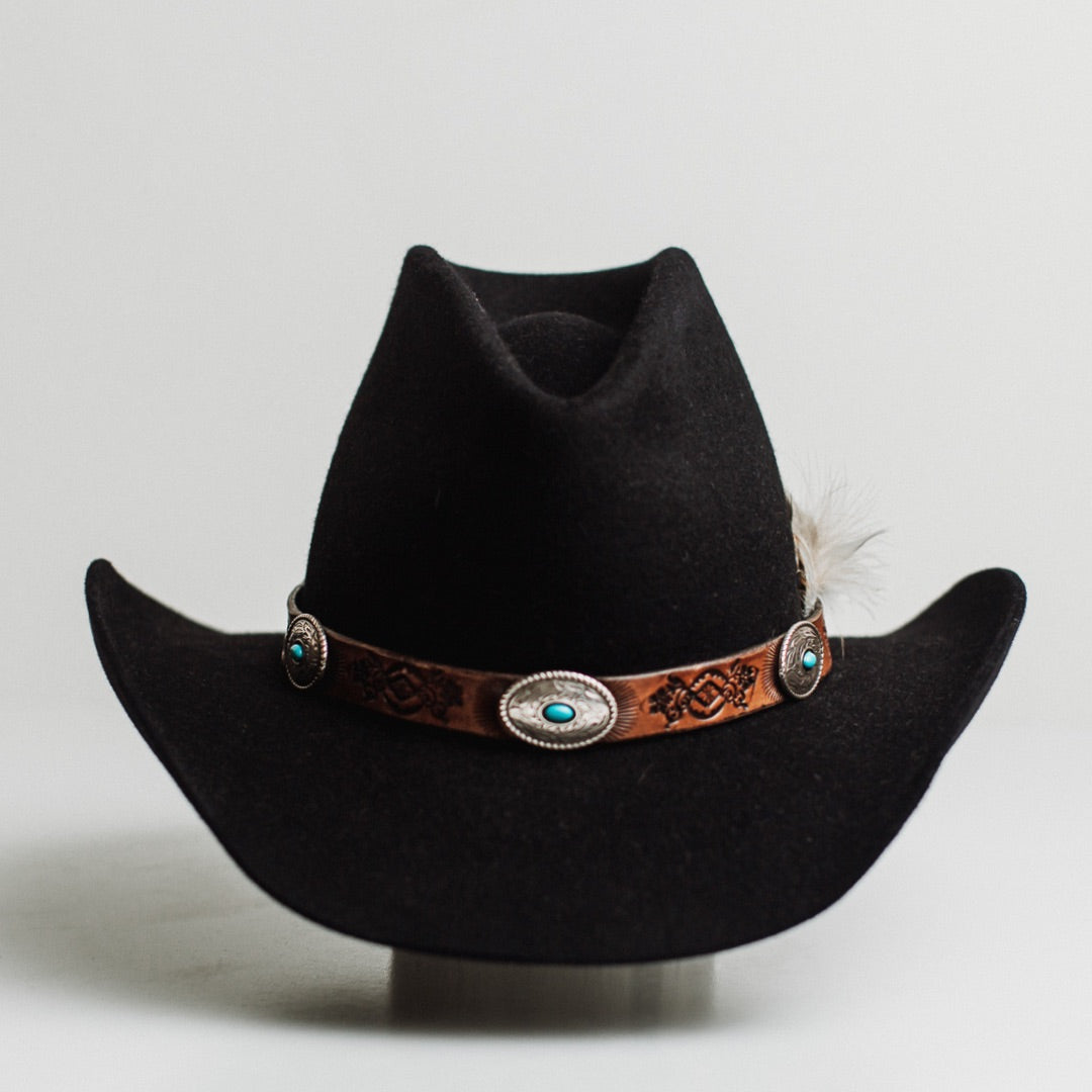 The PHYLLi dark navy felt hat by PHYLLi Designs with Buffalo Girl Rugged Desert tie back leather hat band.